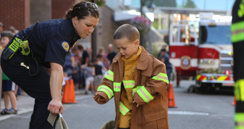 female firefighter and little boy