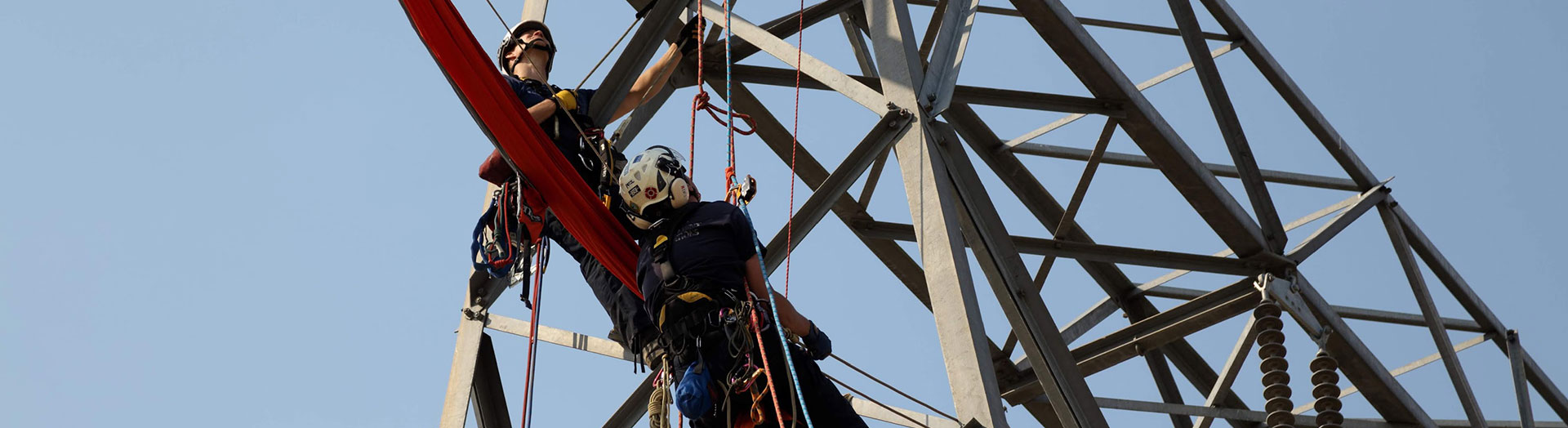 2 fire fighters training on electrical structure.