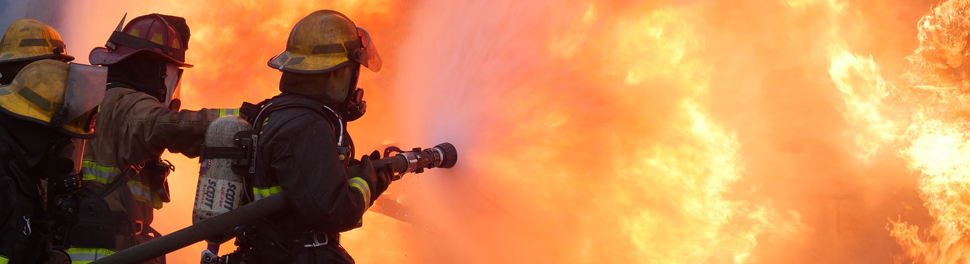 3 fire fighters battling huge inferno